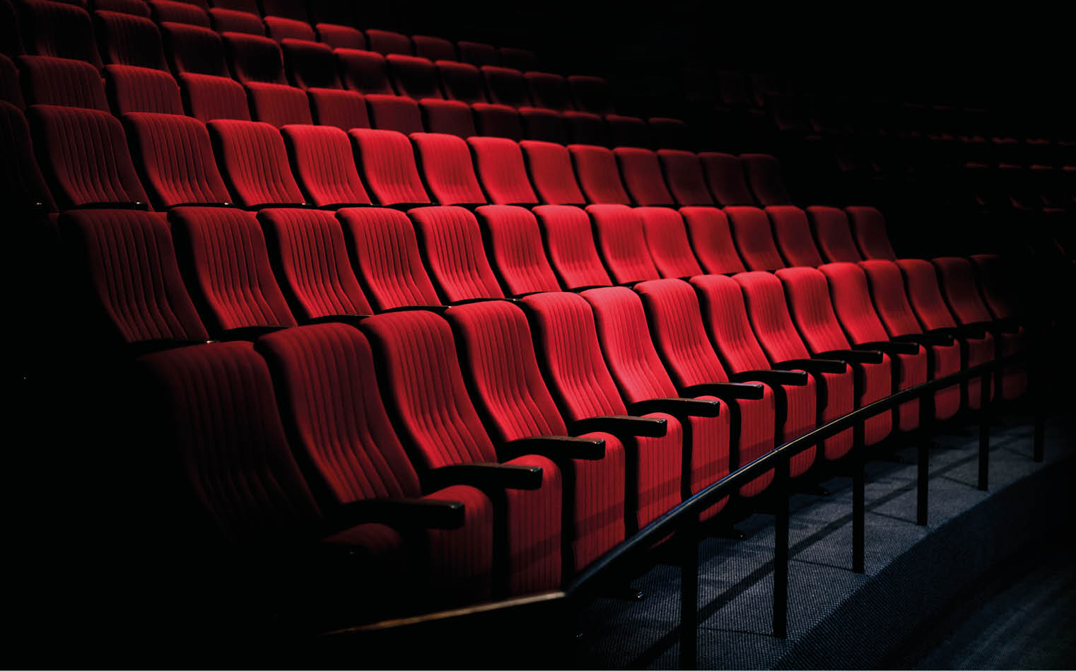 Rows of red seats in a theater